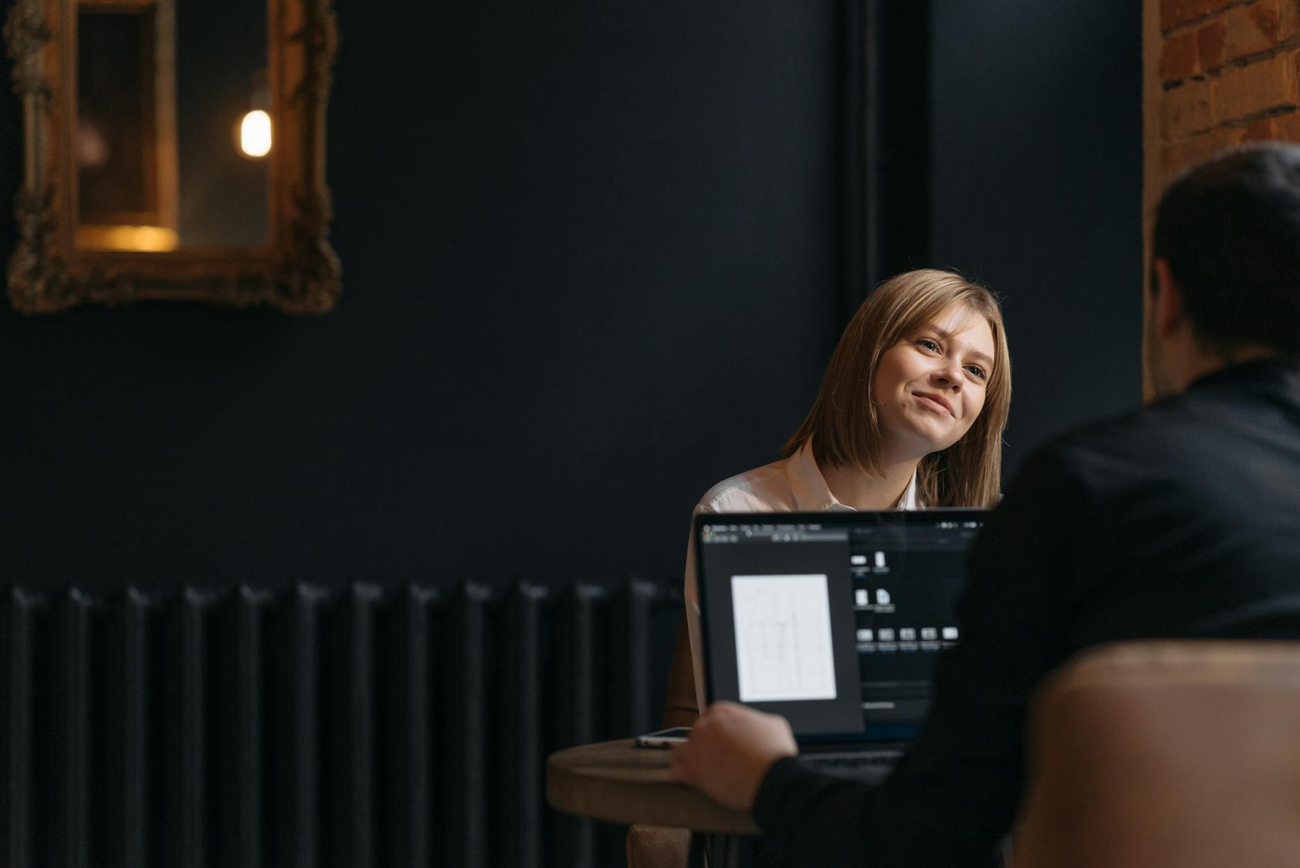 Two people collaborating over a brand brief